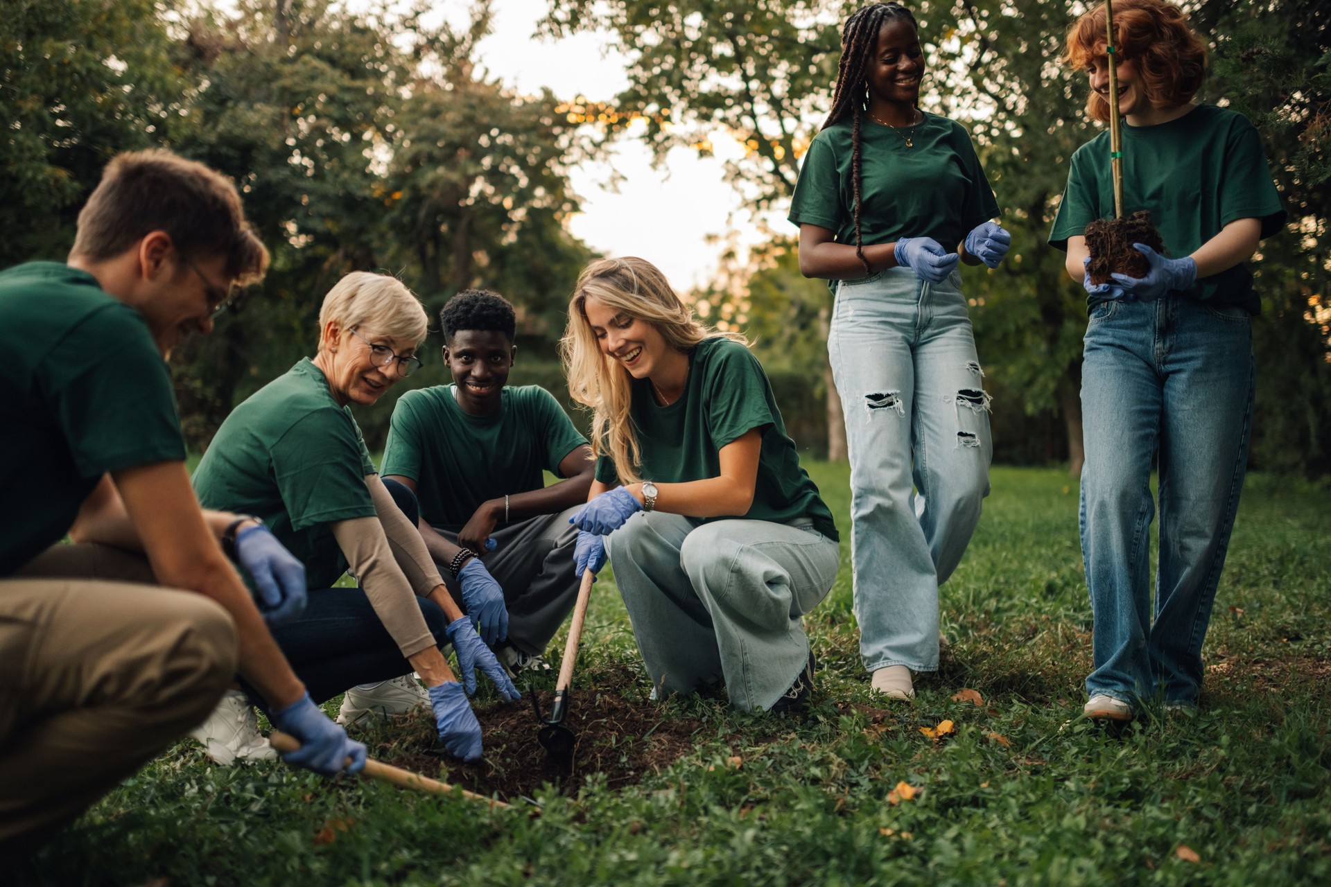 Volunteers planting trees in a park: promoting sustainability together